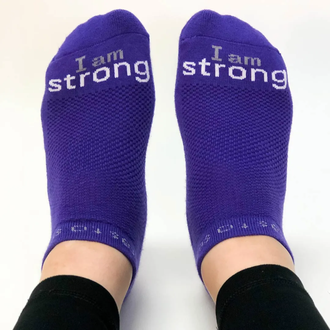 I am strong™ purple low-cut socks with white words