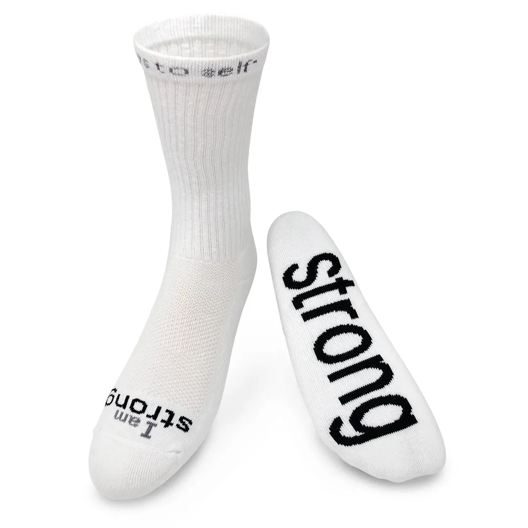 I am strong™ white crew socks with black words