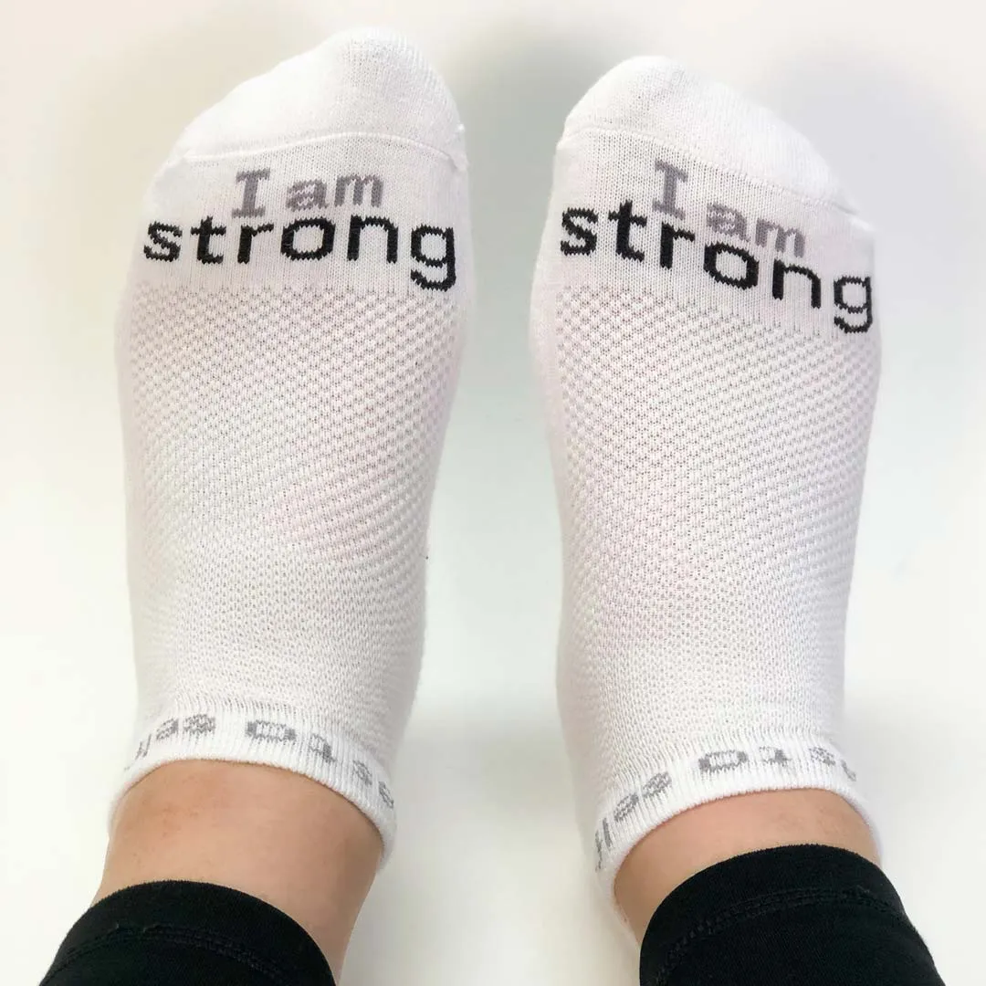 I am strong™ white low-cut socks with black words